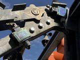 a close up view of a cell phone mounted to the side of an oil rig