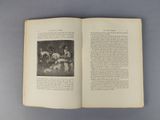 an open book with a picture of a man and a dog on it