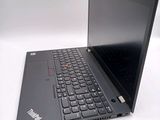 a black laptop with a black keyboard on a white surface