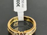an image of a couple of gold rings with diamonds on them