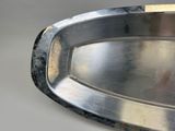 a close up of a metal tray on a table