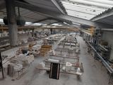many tables and benches in a large room