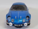 a blue toy car that is sitting on a white surface