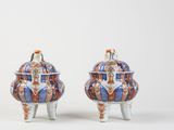 pair of chinese vases with handles and feet in blue, orange, and white