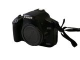a black camera with a strap attached to it