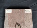 a picture of a pair of scissors sitting on top of a piece of concrete