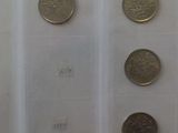 a lot of coins that are on display in a case