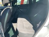 the back seats of a car are empty in a parking lot