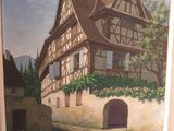 a picture of a painting of a house on the wall