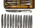 a lot of knives that are in a case