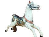 a white horse with a saddle on it ' s back