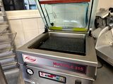 a machine that is sitting on a counter in a kitchen