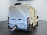 a white van that is parked inside of a building