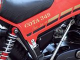 a red motorcycle parked on the side of the road