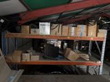 many boxes on the shelves in the garage