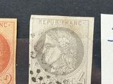 three different types of stamps are on display in a glass case