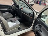 the interior of a car with the door open in a garage