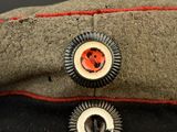an image of a close up of two buttons on a hat