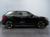 the black suv is parked in a room with a gray wall