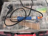 a small box with tools in it sitting on a table