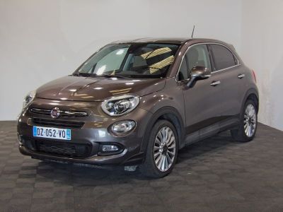 the small car is parked in the showroom on the tile floor