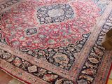 a large oriental rug on the floor in a room