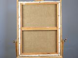 a wooden easel with a canvas on top of it
