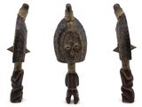 three wooden figurines of different shapes and sizes on a white surface