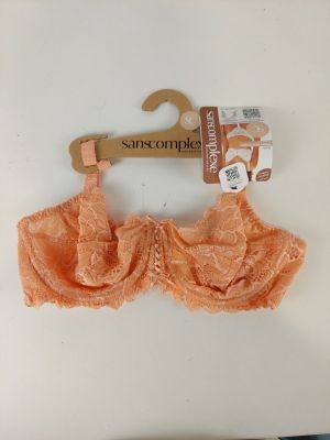 an orange bra top with a wooden hanger attached to it