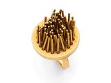 a wooden plate with a bunch of nails on it