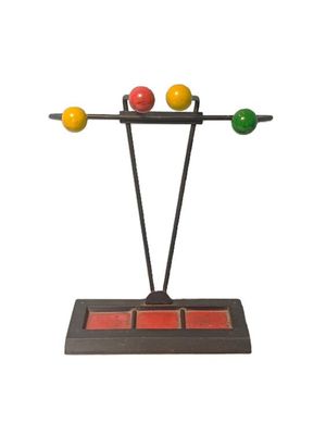 an image of a sculpture of three balls on a stand