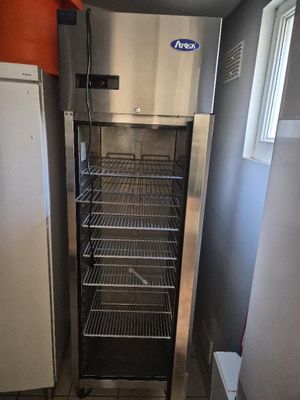 an image of a kitchen with a refrigerator and a freezer