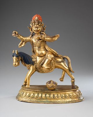 statue of a man on a horse with a ball in his hand
