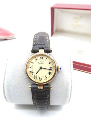 a watch that is sitting on top of a white ring
