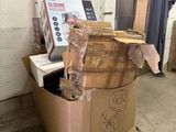 a cardboard box sitting on top of a pallet in a warehouse