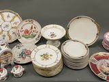 many different types of plates and bowls on the table