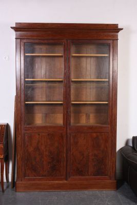 an image of a large wooden bookcase in a living room