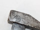 a hammer that is sitting on top of a piece of metal