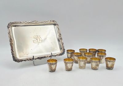 a set of six silverplated cups and a tray with a picture frame