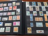 a black folder with a lot of stamps on it