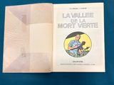 an open book with a picture of a man holding a cat