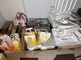 many bags of food sitting on the floor next to a stack of boxes