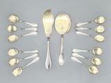 six silver spoons and six silver spoons arranged in a circle
