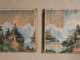 deux tableaux accrochés au mur au-dessus d'un canapé