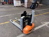 an image of a fork lift truck in a warehouse