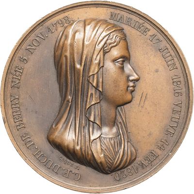 an image of a bronze medal with a woman ' s profile on it
