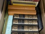 a box full of books sitting on top of a table