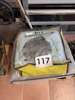 a bag of food sitting on the floor next to a stove