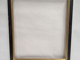 a black and gold picture frame with a white background