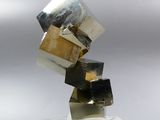 sculptures made of metal and glass are stacked on top of each other
